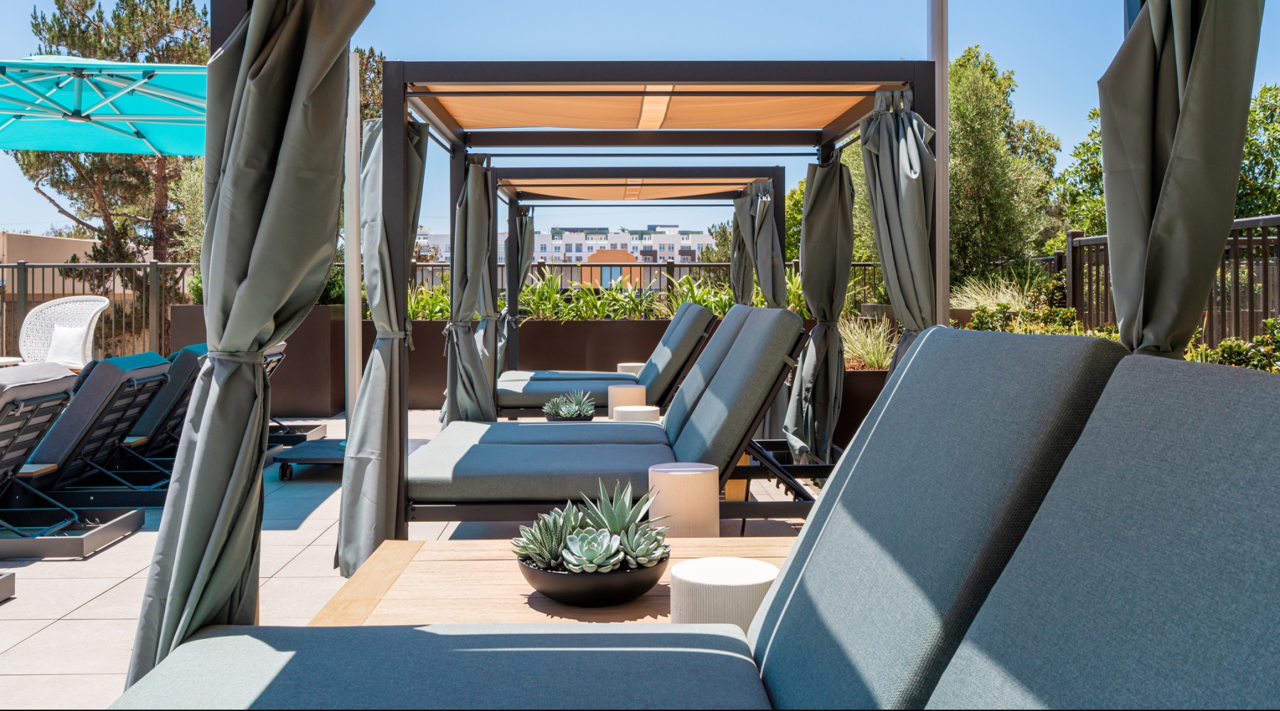 Resort style lounge chairs off pool deck
