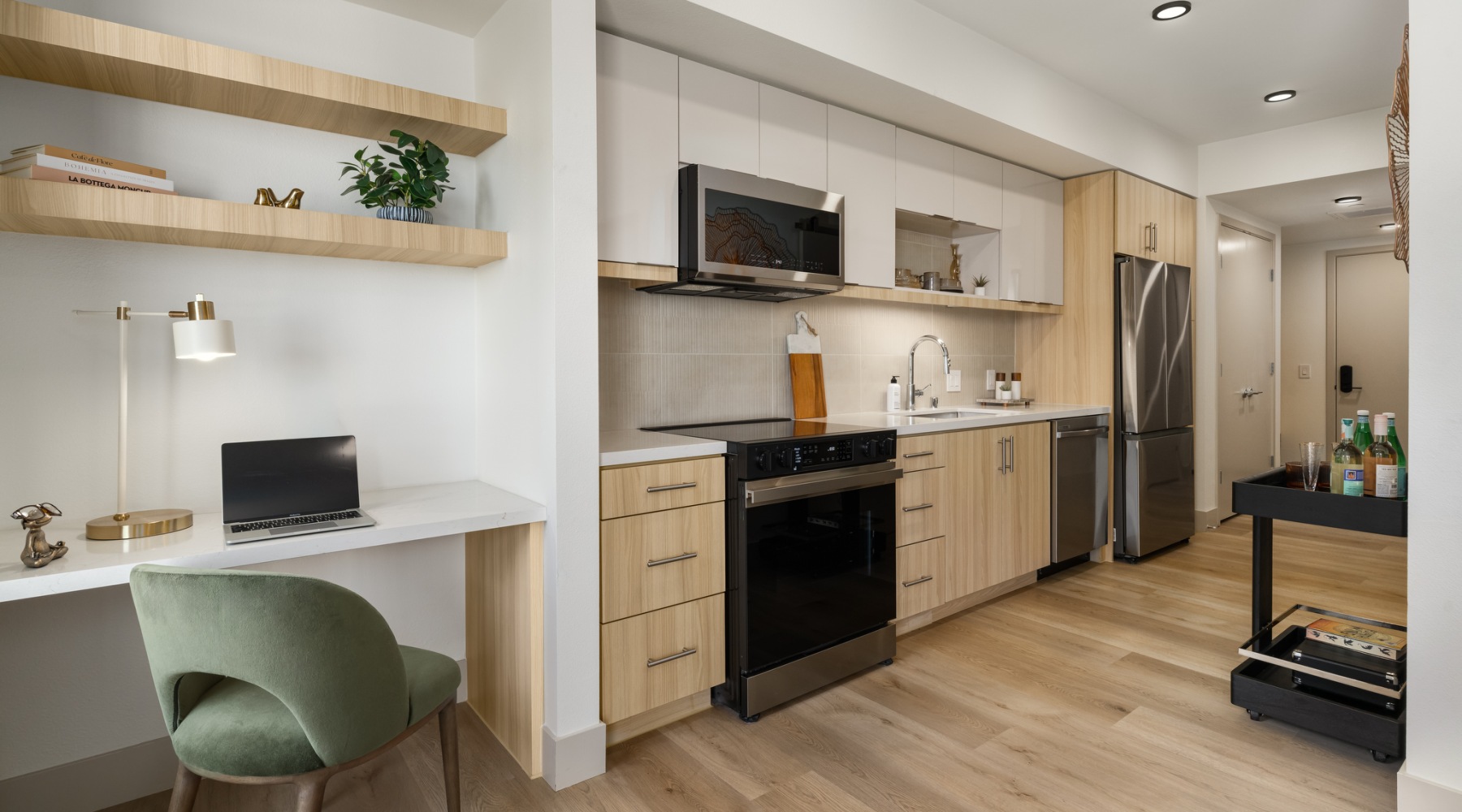 1 bedroom apartment with stainless steel appliances and desk