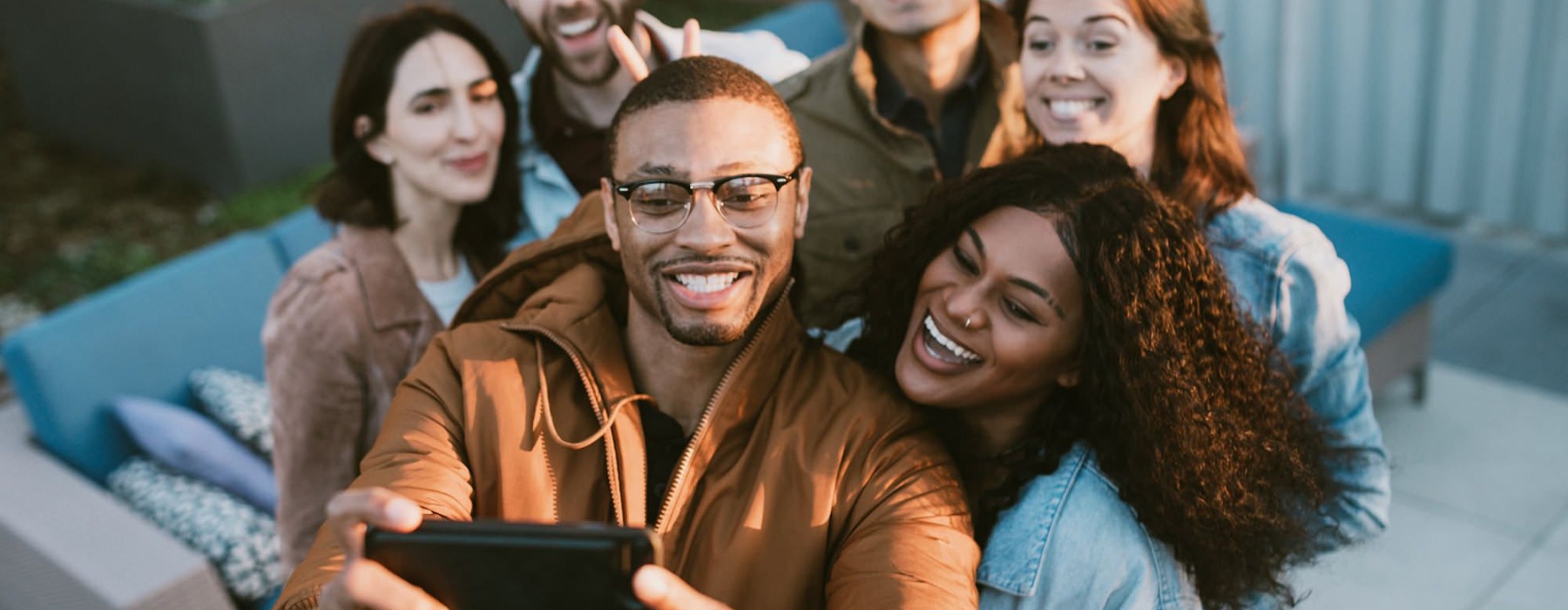 friends take a group selfie outdoors