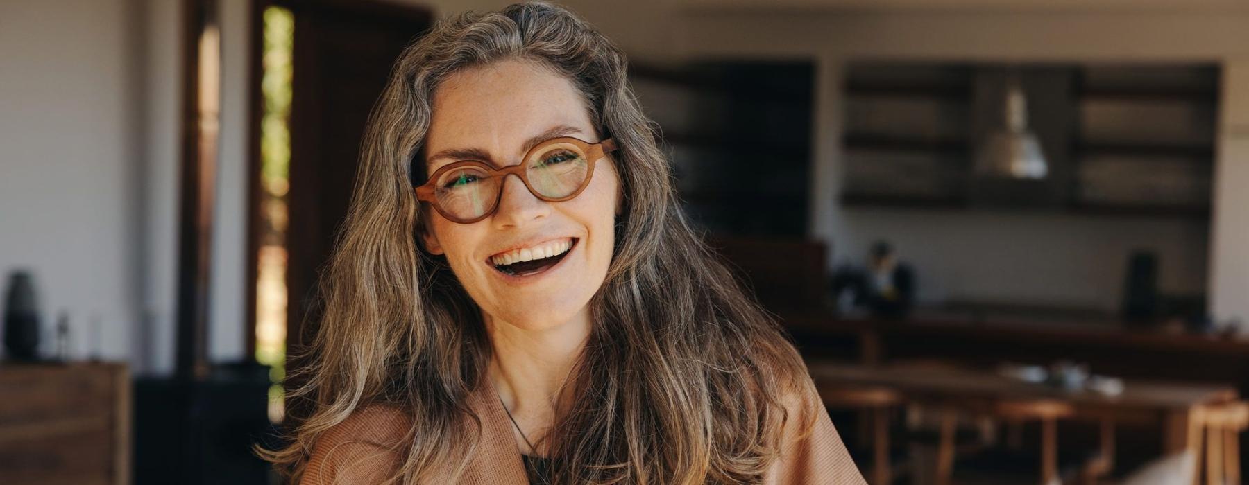 a woman holding a cup